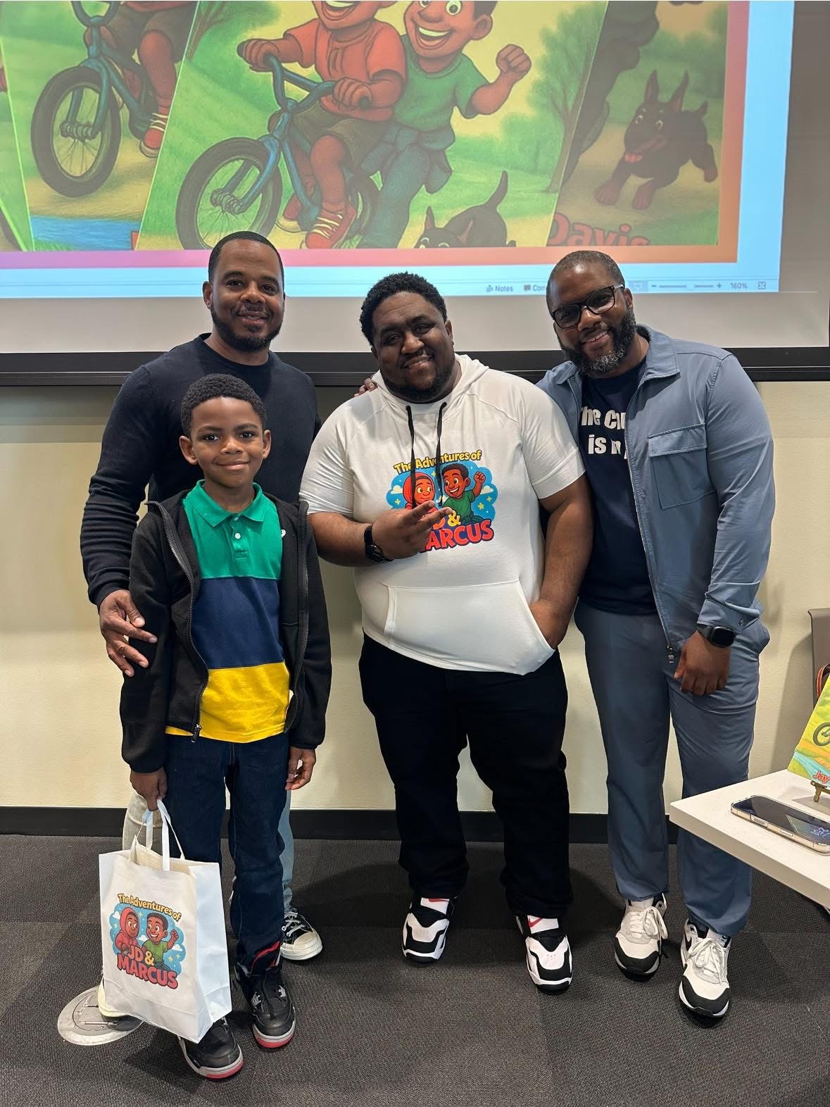 Young reader with Jay and a JD & Marcus tote bag